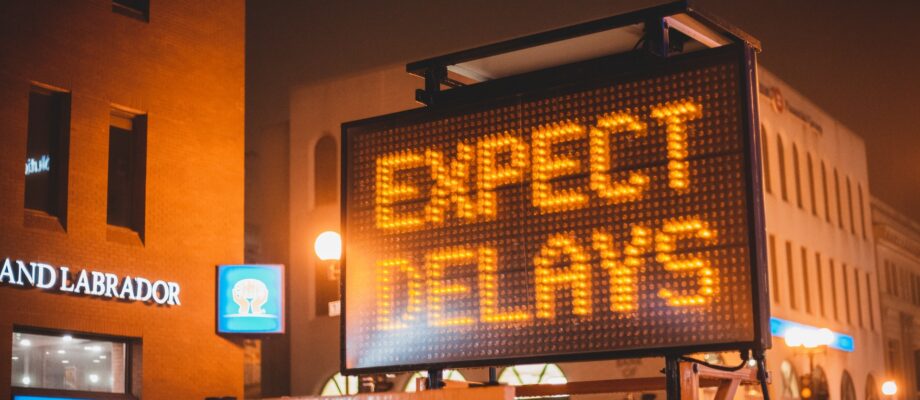 the words expect delays displayed on digital billboard