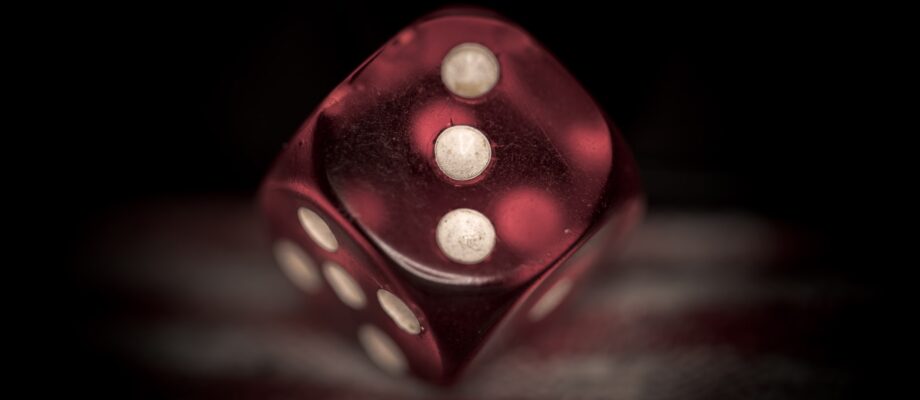 red die with the three facing up