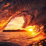sunset framed by a heart-shaped wave
